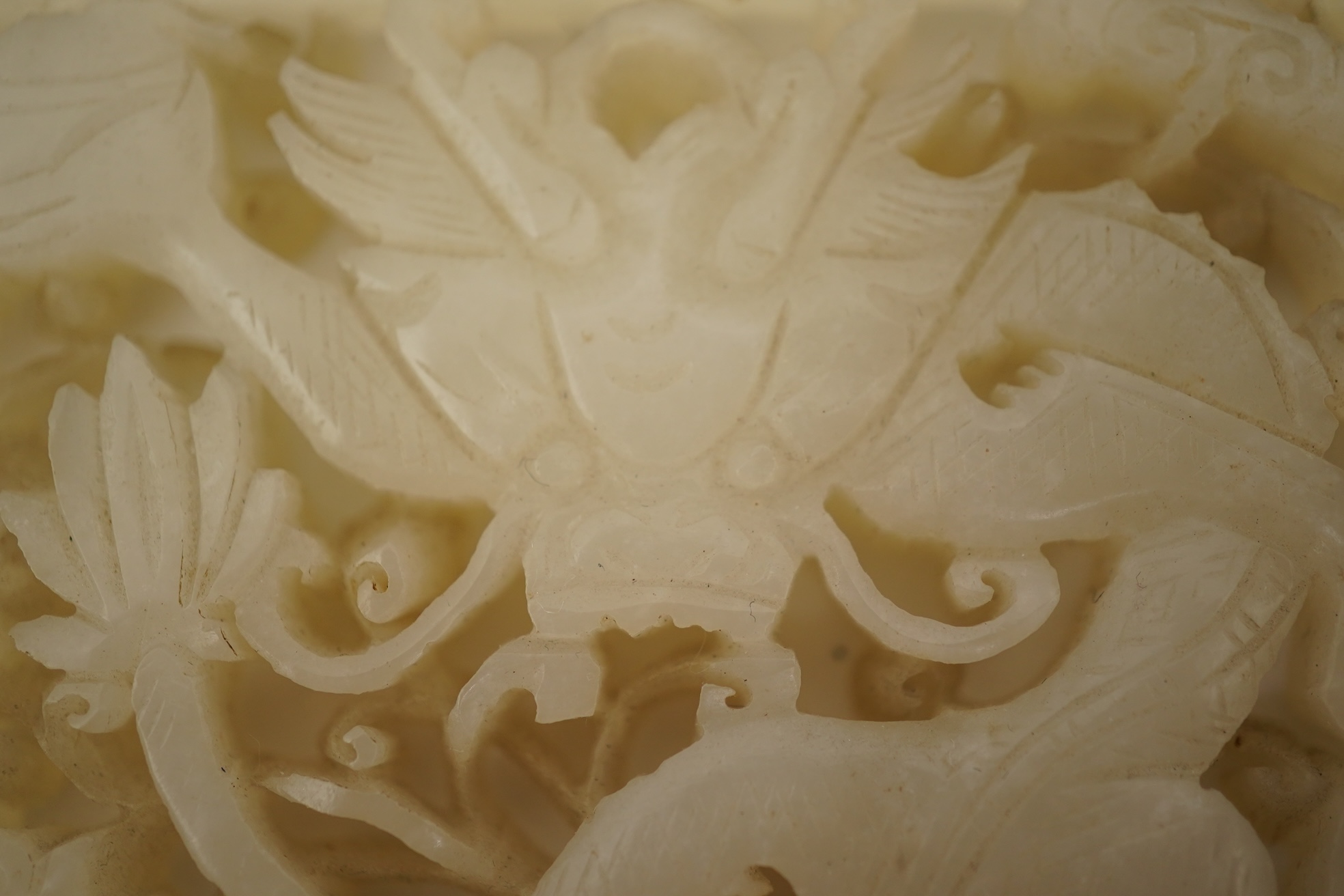 A Chinese reticulated white jade ‘dragon’ plaque, 18th century